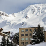 Andermatt house and mountains