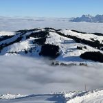 skiwelt skiing above clouds